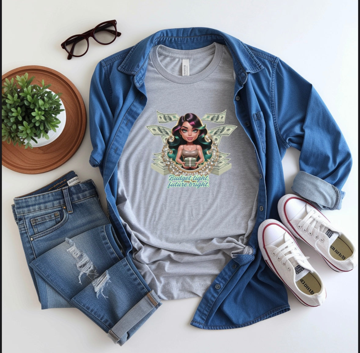 Gray Money Magnet Tee with cartoon woman and money graphic, paired with denim shirt, ripped jeans, white sneakers, and black glasses on white background